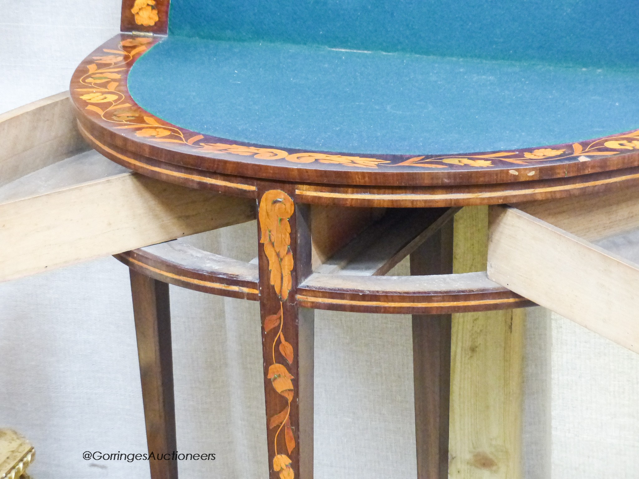 An early 19th century Dutch floral marquetry walnut D shaped folding card table, width 80cm, depth 45cm, height 76cm